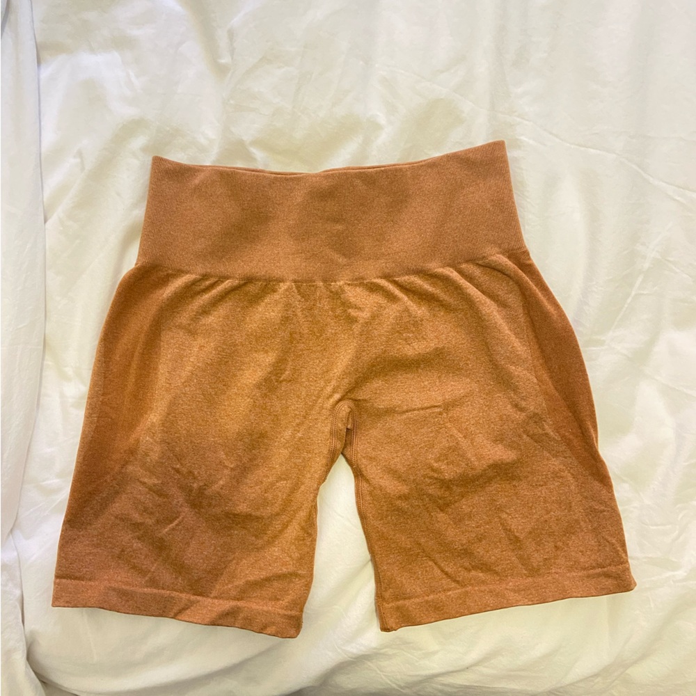 NVGTN burnt orange gym shorts